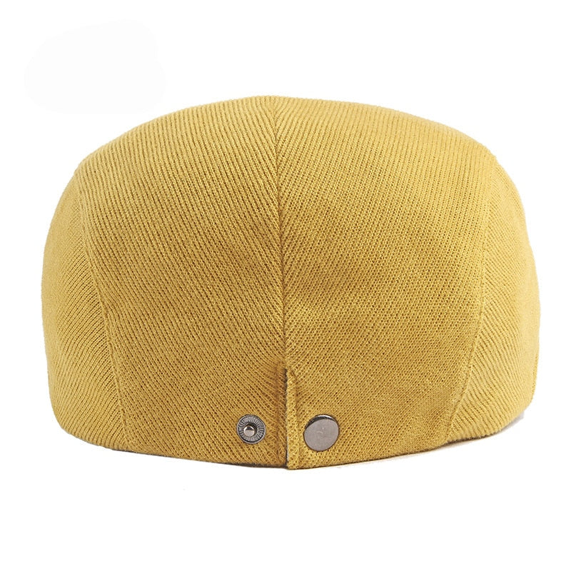 gorra plana amarilla hombre